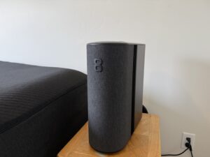 Eight Sleep Pod 5 Hub unit sitting beside a nightstand next to the bed