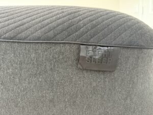 Close-up of the Eight Sleep logo stitched on the Pod 5 cover