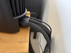 Close-up of the cords and water tubing routed behind the Eight Sleep Pod 5